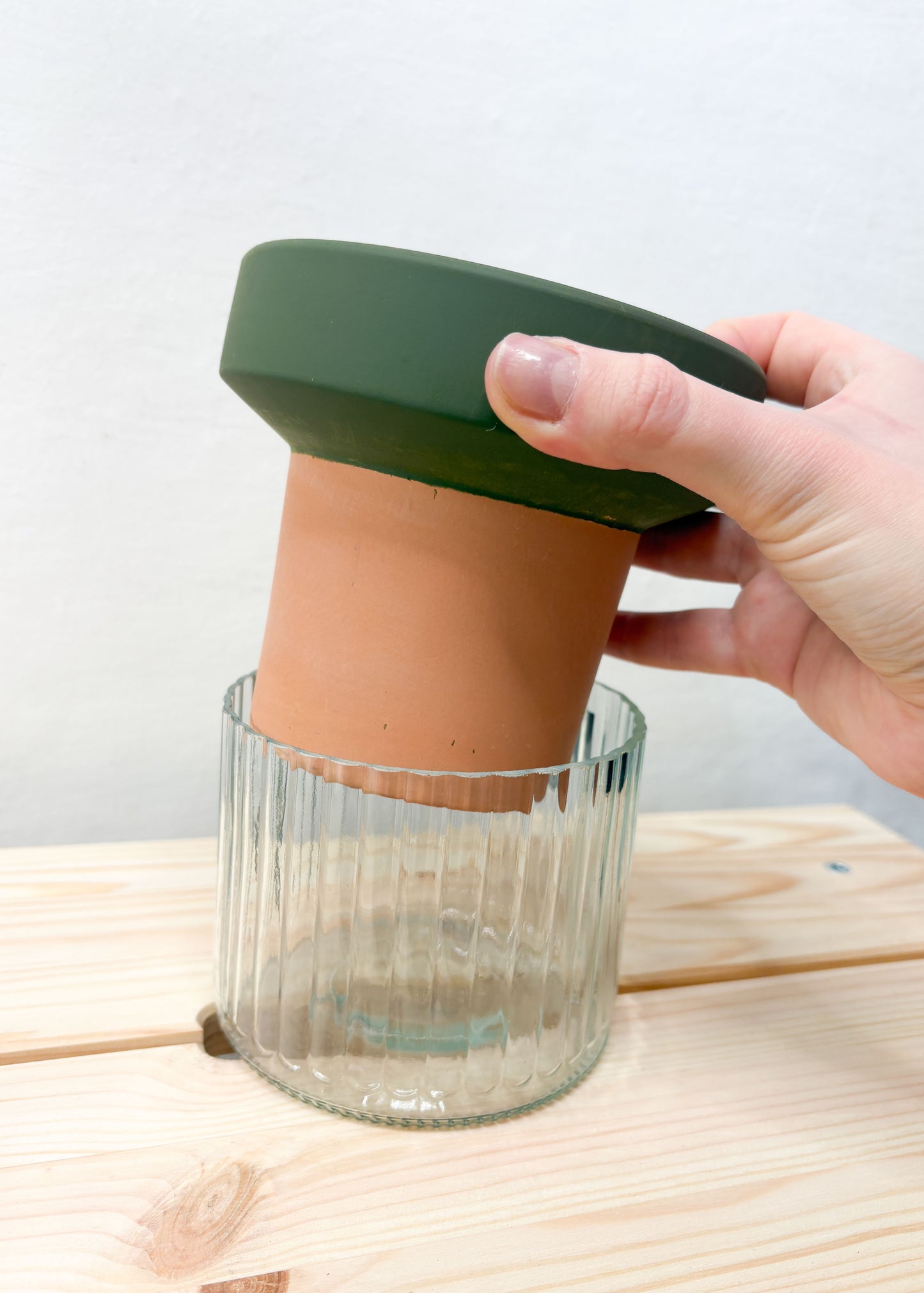 Pot with a self-watering system