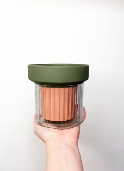 Pot with a self-watering system